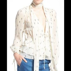 Olivia Palermo sheer ivory blouse